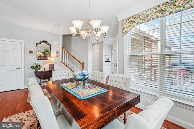 44451 Cruden Bay Dr, Ashburn, VA 20147 - dining space with baseboards, a chandelier, wood finished floors, and stairway