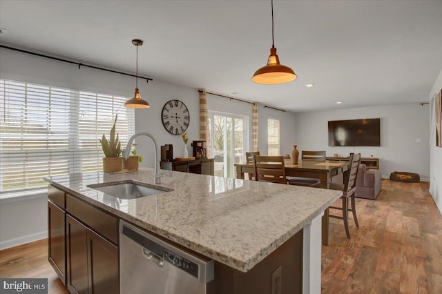 11174 Cross Fields Dr, Waynesboro, PA 17268 - kitchen featuring stainless steel dishwasher, baseboards, open floor plan, a sink, and hanging light fixtures