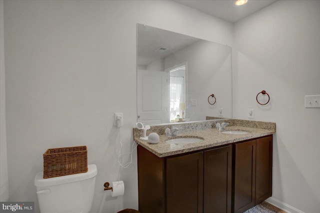11174 Cross Fields Dr, Waynesboro, PA 17268 - bathroom with double vanity, a sink, baseboards, and toilet