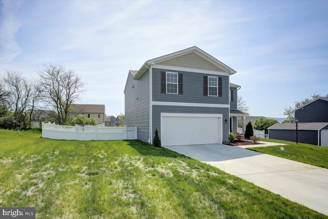 11174 Cross Fields Dr, Waynesboro, PA 17268 - view of side of home featuring fence, a yard, an attached garage, and concrete driveway