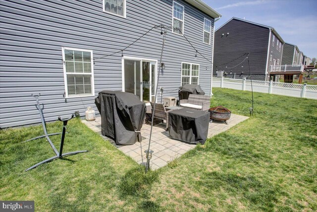 11174 Cross Fields Dr, Waynesboro, PA 17268 - back of property with a lawn, a fire pit, fence, and a patio