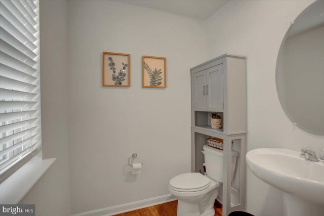 11174 Cross Fields Dr, Waynesboro, PA 17268 - bathroom featuring a sink, wood finished floors, and toilet