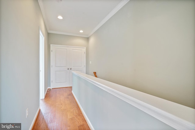 22788 Sagamore Sq, Brambleton, VA 20148 - hallway with an upstairs landing, recessed lighting, crown molding, light wood finished floors, and baseboards