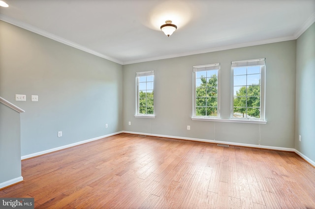 22788 Sagamore Sq, Brambleton, VA 20148 - empty room featuring crown molding, wood-type flooring, baseboards, and visible vents