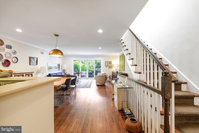interior space with recessed lighting, ornamental molding, and wood finished floors