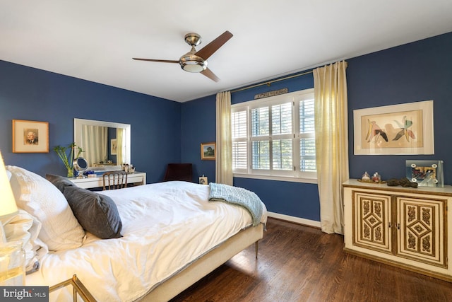 bedroom featuring baseboards, a ceiling fan, and wood finished floors
