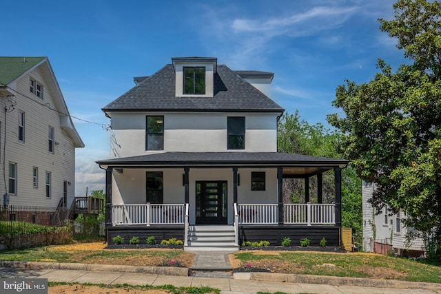 1904 Jackson St NE, Washington, DC 20018 - view of front of house with a porch, a shingled roof, stucco siding, and fence