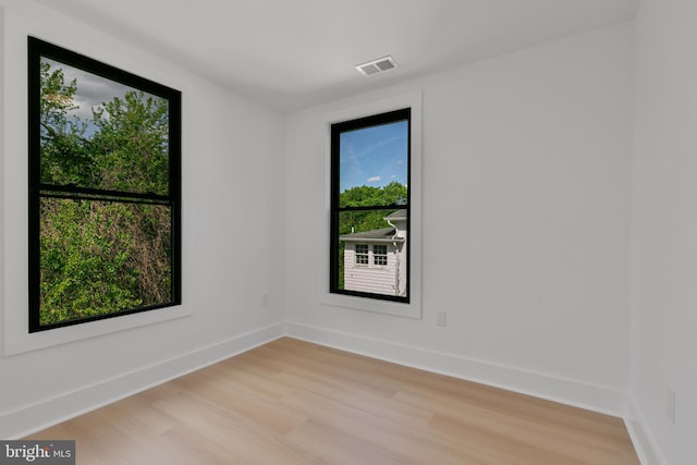 1904 Jackson St NE, Washington, DC 20018 - spare room with baseboards, plenty of natural light, light wood-type flooring, and visible vents