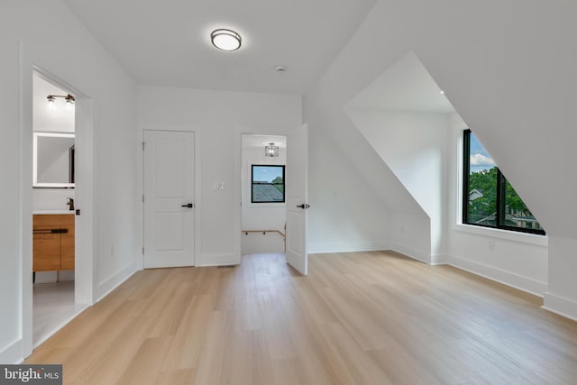 1904 Jackson St NE, Washington, DC 20018 - additional living space with baseboards, a healthy amount of sunlight, and light wood finished floors