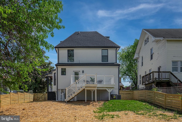 1904 Jackson St NE, Washington, DC 20018 - rear view of house with a deck, a fenced backyard, roof with shingles, stucco siding, and stairs