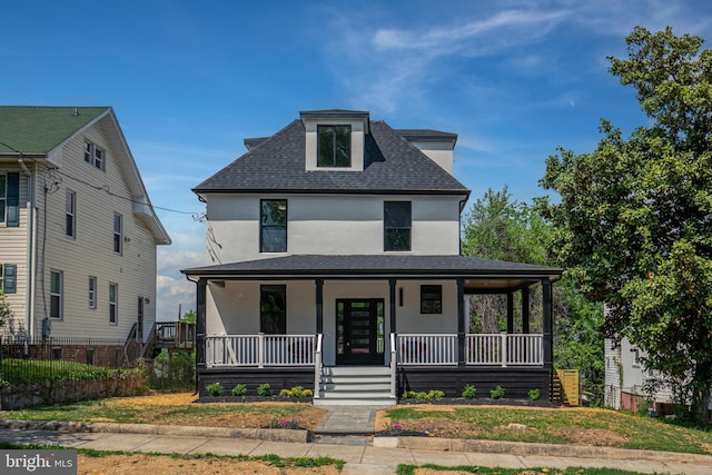 1904 Jackson St NE, Washington, DC 20018 - view of front of home featuring a porch, fence, roof with shingles, and stucco siding