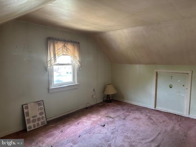 919 Belmont Ave, Haddon Township, NJ 08108 - bonus room featuring vaulted ceiling, carpet floors, and baseboards