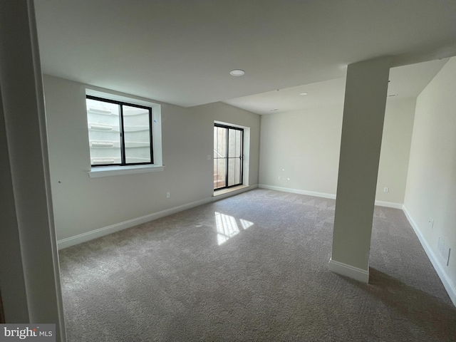carpeted spare room with baseboards and recessed lighting