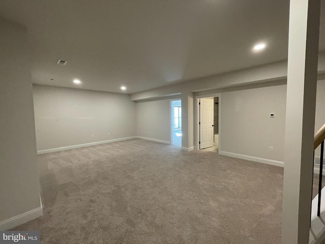 below grade area with baseboards, carpet flooring, and recessed lighting