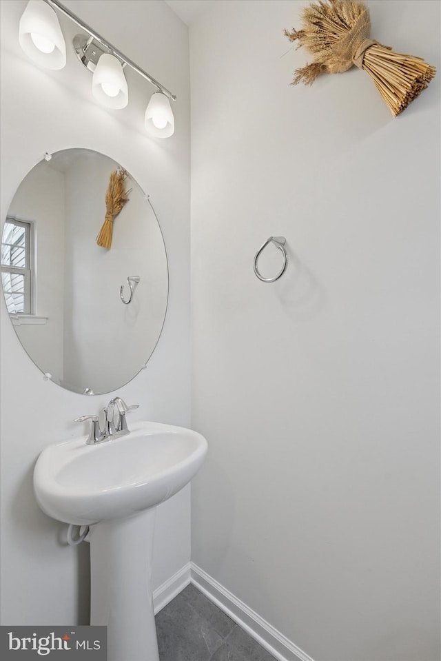 bathroom with baseboards