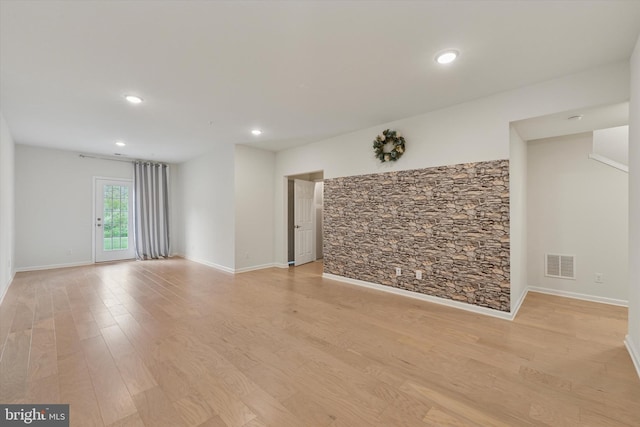 interior space with recessed lighting, baseboards, visible vents, and light wood-style floors