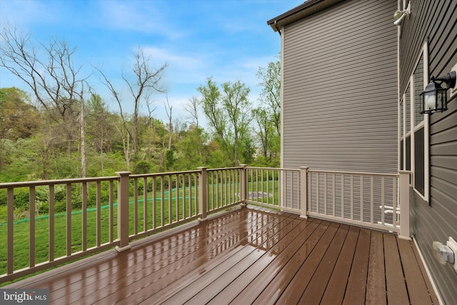 wooden deck with a yard
