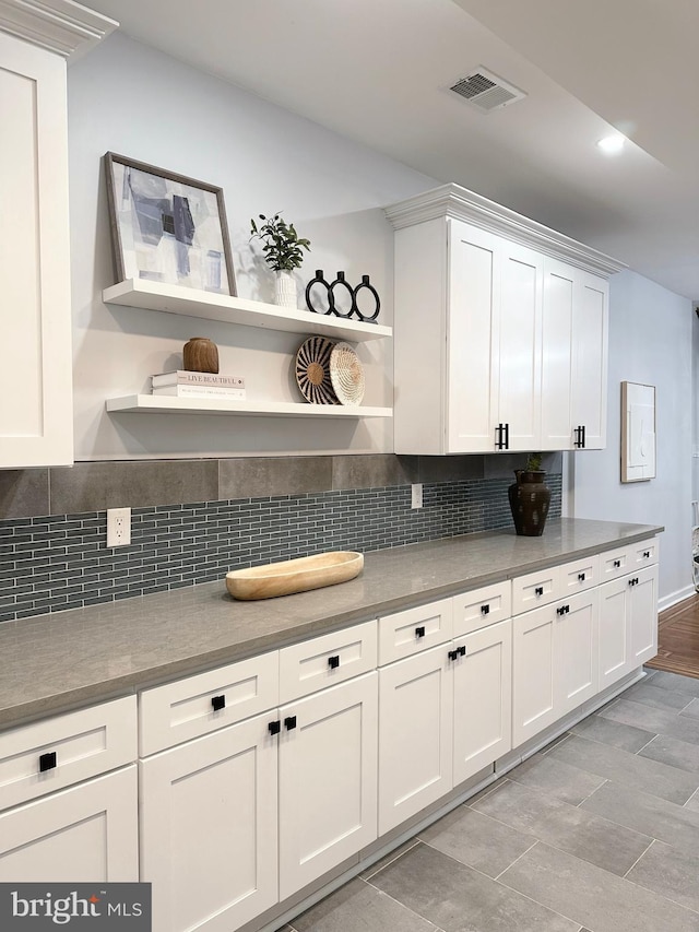 1724 N 62nd St, Philadelphia, PA 19151 - kitchen featuring open shelves, white cabinetry, and tasteful backsplash