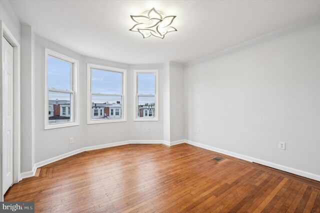 1724 N 62nd St, Philadelphia, PA 19151 - spare room with wood-type flooring and baseboards