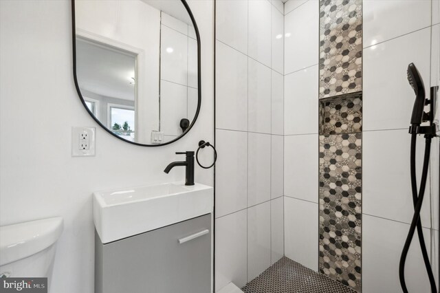 1724 N 62nd St, Philadelphia, PA 19151 - bathroom with toilet, tiled shower, and vanity