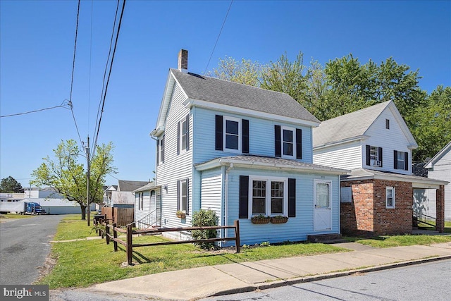 223 Henry St, Cambridge, MD 21613 - view of front of house with fence and a chimney