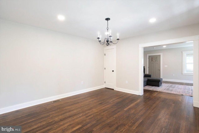 223 Henry St, Cambridge, MD 21613 - unfurnished room featuring an inviting chandelier, recessed lighting, baseboards, visible vents, and dark wood-style floors
