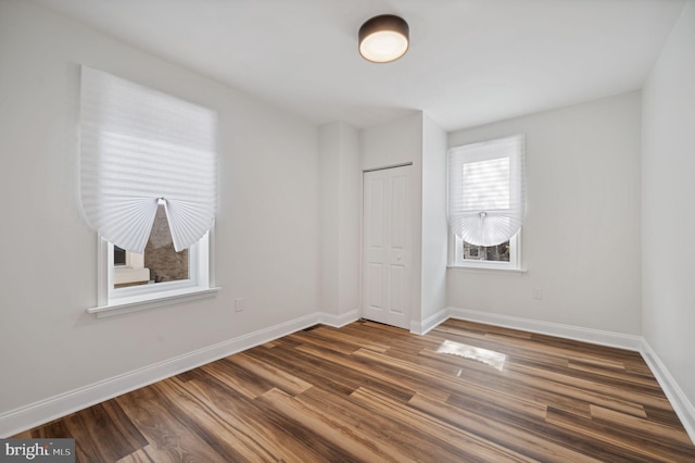 1544 N Allison St, Philadelphia, PA 19131 - unfurnished bedroom with baseboards, dark wood finished floors, and a closet