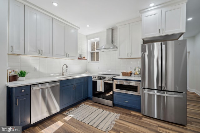 1544 N Allison St, Philadelphia, PA 19131 - kitchen featuring a sink, blue cabinets, wall chimney exhaust hood, and appliances with stainless steel finishes