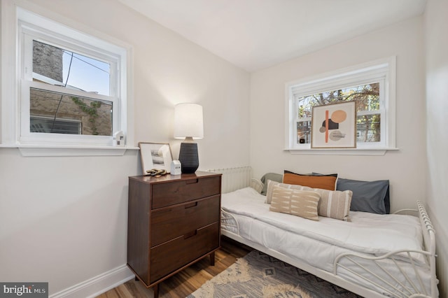1544 N Allison St, Philadelphia, PA 19131 - living area with baseboards, radiator heating unit, and dark wood-style floors