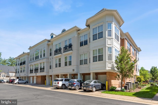 8600 Liberty Trl Unit 102, Manassas, VA 20110 - view of building exterior with central AC and uncovered parking