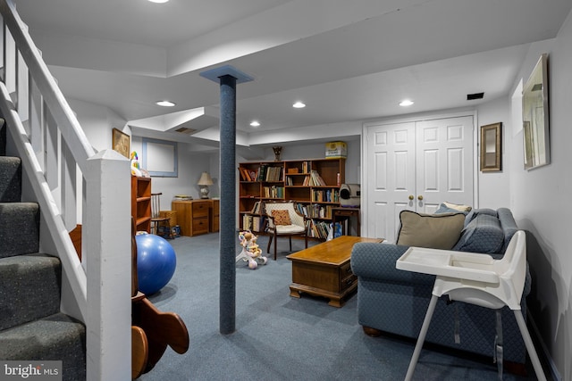 sitting room with carpet flooring, recessed lighting, stairway, and decorative columns