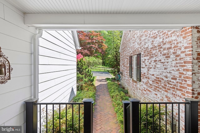 view of property exterior with brick siding