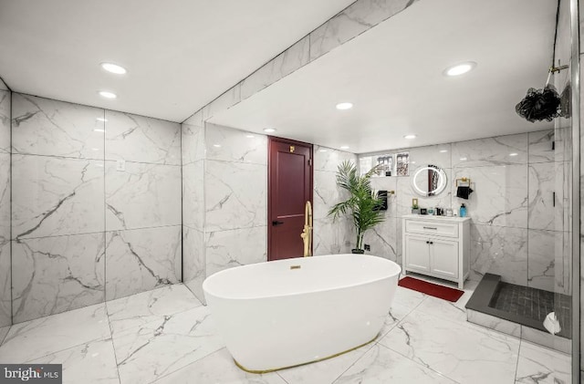 full bathroom with vanity, recessed lighting, a marble finish shower, and marble finish floor