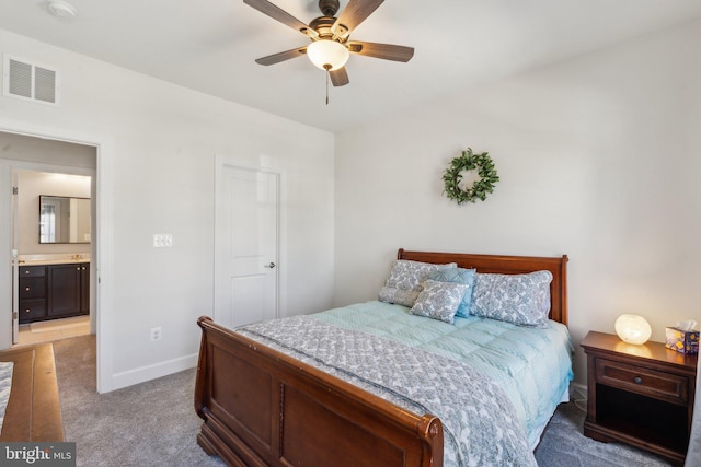 bedroom with visible vents, a ceiling fan, baseboards, and light colored carpet