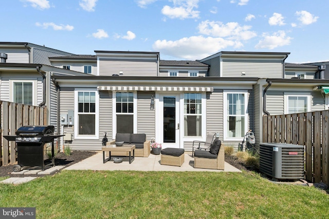 back of property featuring fence, a patio, an outdoor hangout area, and cooling unit