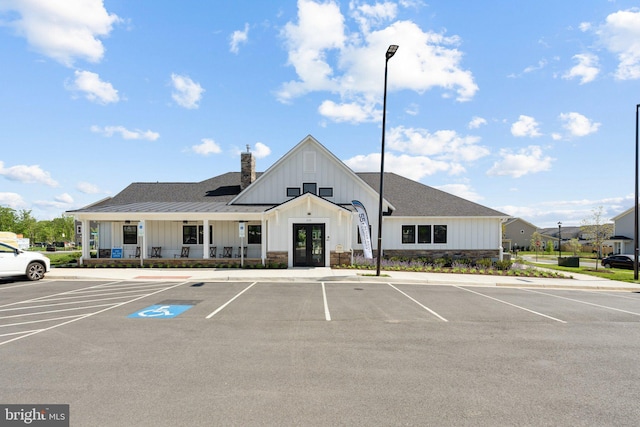 view of building exterior featuring uncovered parking