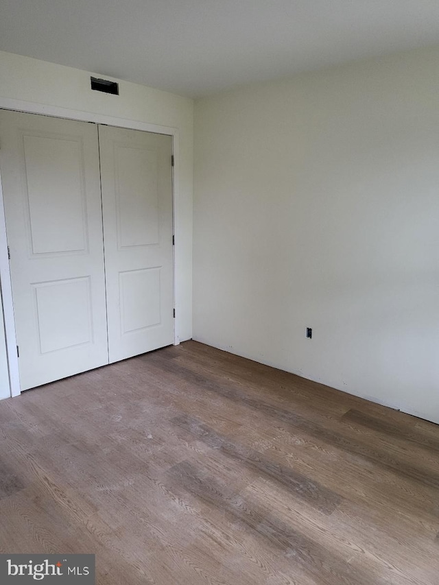 1386 Haddon Ave, Camden, NJ 08103 - unfurnished bedroom featuring wood finished floors and a closet
