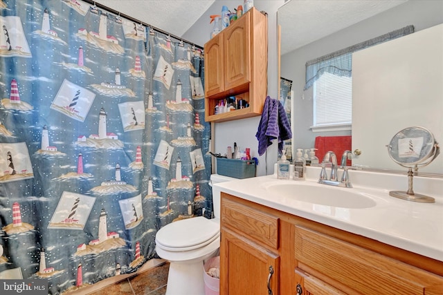 bathroom featuring vanity, toilet, a textured ceiling, tile patterned floors, and a shower with curtain