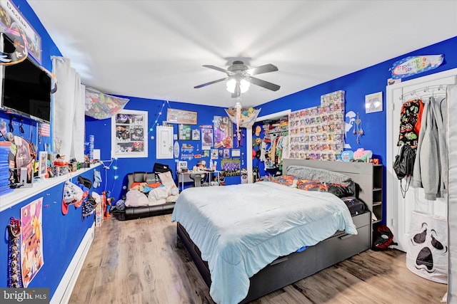 bedroom featuring ceiling fan and wood finished floors