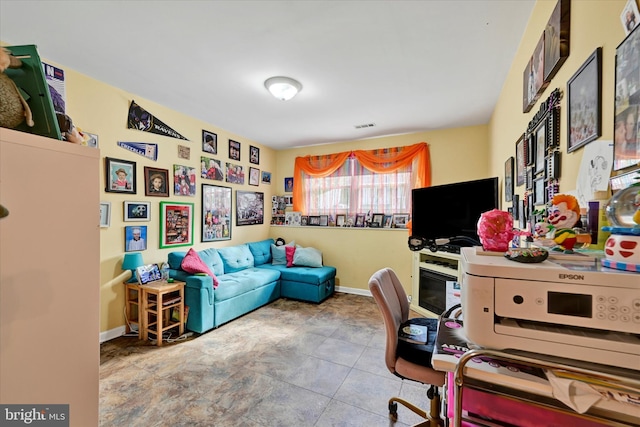 office space featuring baseboards and visible vents