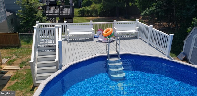 pool with a wooden deck