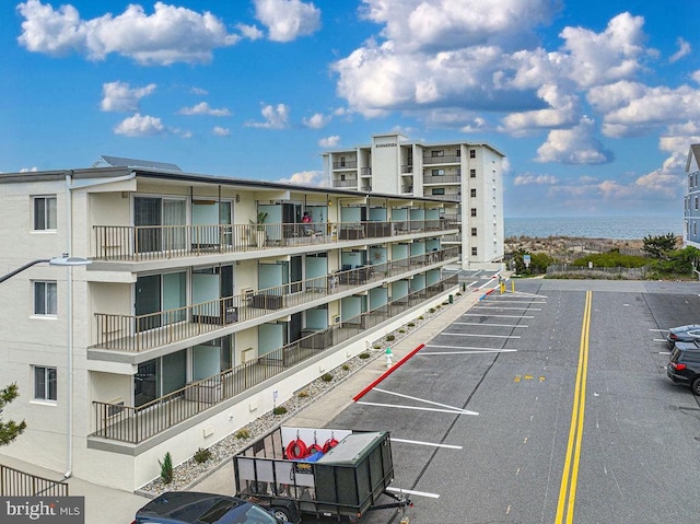 view of property with uncovered parking