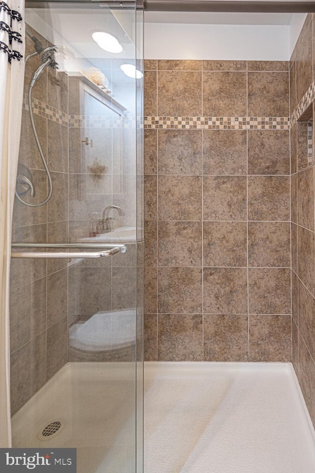 bathroom featuring a shower stall