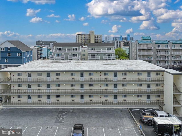 view of property with uncovered parking