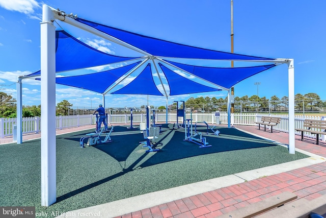 view of jungle gym with fence