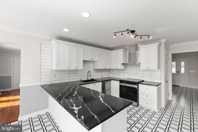 kitchen with white cabinets, crown molding, a sink, electric range oven, and wall chimney exhaust hood