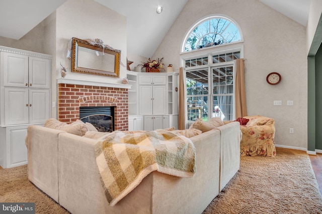 living room with high vaulted ceiling, baseboards, and a fireplace