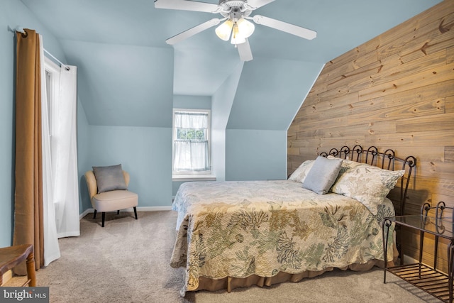 bedroom with baseboards, carpet, ceiling fan, and vaulted ceiling