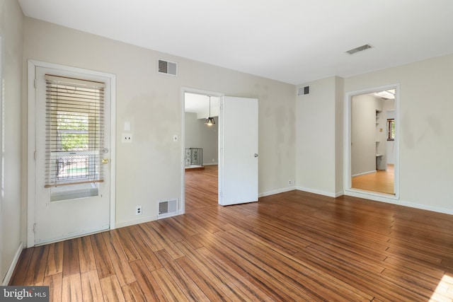 interior space featuring visible vents and wood finished floors