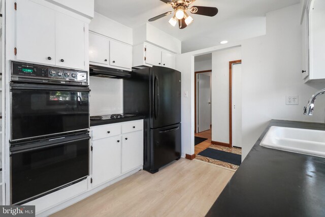 kitchen featuring a ceiling fan, a sink, black appliances, light wood-style floors, and under cabinet range hood